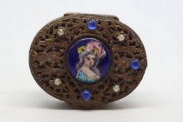 Gilt metal pill box, the top is set with a painted enamel portrait of a lady, surrounded by carved