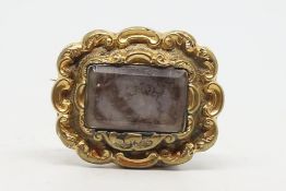 Victorian mourning brooch, central rectangular hair compartment, within a yellow metal frame,