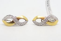 Diamond set earrings, with single cut diamonds, mounted in a figure of eight motif, in bi-colour