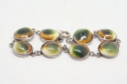 Silver operculum link bracelet, with silver chain connections