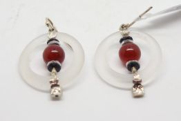 A pair of Art Deco rock crystal, onyx and cornelian drop earrings, central carnelian bead between