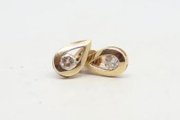 Diamond drop studs, single round brilliant cut diamond in a pear drop mount, estimated total diamond