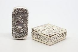 S silver decorative pill box, together with a silver vesta case