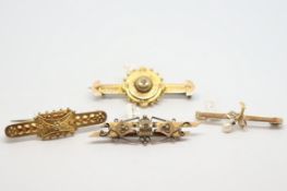 Four bar brooches, including Etruscan style bar brooches, a diamond and pearl bar brooch stamped 9ct