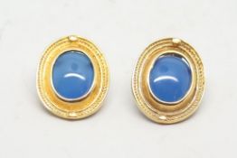 A pair of blue stone earrings, oval blue stones Etruscan style surround, stamped 14ct, makers mark