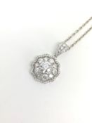 Brilliant cut diamond cluster pendant, centre brilliant cut diamond claw set within a cluster of