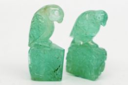 A pair of carved emerald parrot figures, approximately 167cts of emerald finely carved with a parrot