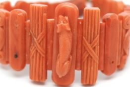 Antique coral panel bracelet, graduated panels of coral, central carving of a resting dog, other