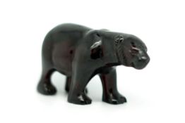 Vintage cherry amber bear, carved figure of a bear on all fours, detailed face and head,