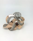 Vintage French diamond ribbon brooch, old and rose cut diamonds set across a scrolling rose gold