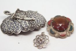 A Russian Niello silver belt buckle, together with a Scottish agate brooch and a small silver