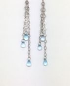 Topaz drop earrings, three chain drops set from each stud, each terminated by a briolette cut blue