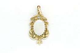 Opal pendant, oval opal set within a 9ct yellow gold floral surround