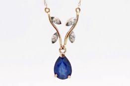 Sapphire necklace, pear cut sapphire, suspended from a leaf style design on an integrated rose metal