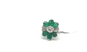 Emerald and diamond dress ring, central round brilliant cut diamond weighing an estimated 0.60ct,