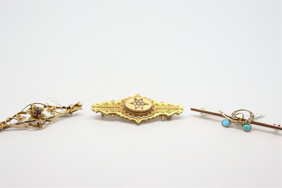 Three bar brooches, including a garnet set brooch, a turquoise and seed pearl brooch and a seed - Image 2 of 2