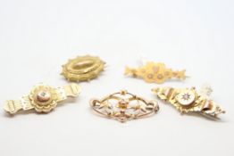 Five bar brooches, including Etruscan style, Art Nouveau and diamond set, all in yellow metal,