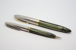 Vintage W.A Sheaffer fountain pen and pencil set, green marbled finish, steel and gold tops, each