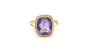 Amethyst dress ring, rub set with rope edge detail, in 9ct yellow gold, ring size O1/2