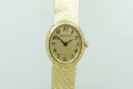 Ladies' Jaeger LeCoultre 18ct Gold Wristwatch, oval gold dial with fancy Arabic numerals, in a