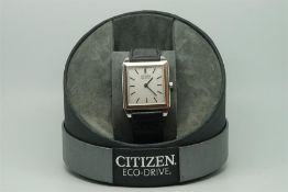 Gentleman's Citizen Eco Drive Wristwatch, square silver dial, leather strap, with box and papers.