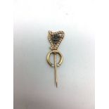 A 19th Century Gold harp stick pin set with pearls and diamond set initials â€œJCâ€. 5cm high.