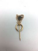 A 19th Century Gold harp stick pin set with pearls and diamond set initials â€œJCâ€. 5cm high.
