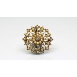Edwardian pearl and diamond wreath brooch, central good white old cut diamond, estimated weight 0.