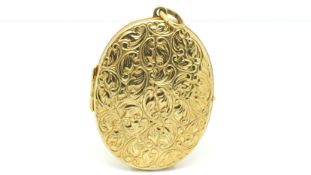 Large oval locket, engraved front, in 9ct, 4x3cm