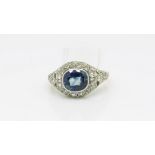 Antique continental sapphire and diamond ring, central oval cut sapphire set within a white gold