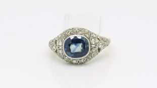 Antique continental sapphire and diamond ring, central oval cut sapphire set within a white gold