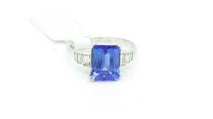 Tanzanite and diamond ring, central rectangular cut tanzanite, excellent deep blue/violet colour,
