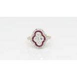Ruby and diamond dress ring, four brilliant cut diamonds with a border of calibre cut rubies, a