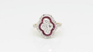 Ruby and diamond dress ring, four brilliant cut diamonds with a border of calibre cut rubies, a