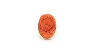 Coral cameo ring, carved cameo 22x16mm, mounted in a yellow gold mount with peered under gallery,