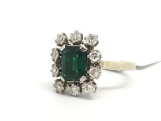 Synthetic emerald and diamond ring, step cut synthetic emerald, surrounded by Swiss cut diamonds,
