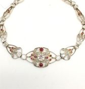 Edwardian French ruby and diamond bracelet, central old cut diamond, estimated weight 0.30ct, set