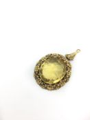 Victorian yellow stone pendant, large faced yellow stone set within an intricate floral, bead and