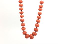 Coral necklace, graduated coral beads, strung knotted on a 9ct gold paste set clasp, gross weight