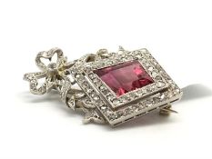 Pink tourmaline and diamond period brooch, unusual kite cut pink tourmaline set within a double