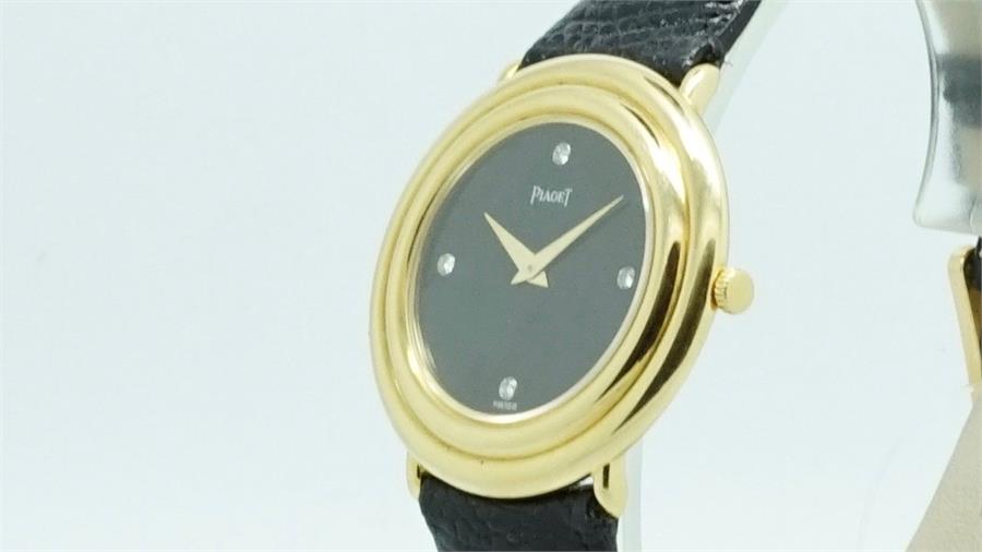 Gentlemen's Piaget Gold Diamond Dot Wristwatch, circular black dial with diamond dot hour markers,