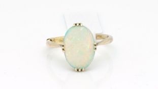 Single stone opal ring, oval cabochon opal measuring approximately 13.2 x 10mm, set in 9ct yellow