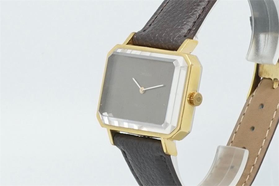 Vintage Omega Retro Wristwatch, rectangular dial with gold plated case, on black leather strap.