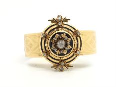 Diamond, enamel and gold suite, comprising a bangle, central rose cut diamond, within a rose cut