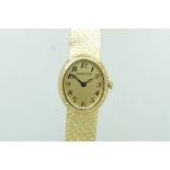 Ladies' Jaeger Le Coultre 18ct Gold Wristwatch, oval gold dial with fancy Arabic numerals, in a