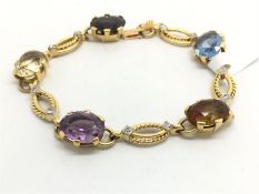 French multi-gem set bracelet, oval cut topaz, citrine, amethyst and garnet, on a fancy link
