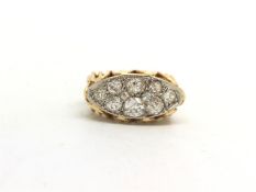 Diamond cluster ring, navette shaped panel set with old cut diamonds, set in white metal, on a