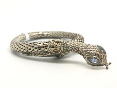 White metal snake bangle, with blue paste set eyes, circa 1940's