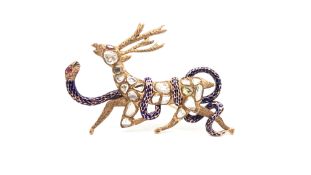 Diamond ruby and enamel brooch, designed as a diamond set Reindeer, with an enamel snake coiled