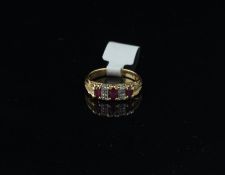 Ruby and diamond carved half hoop ring, three round cut rubies, each separated by two diamonds,